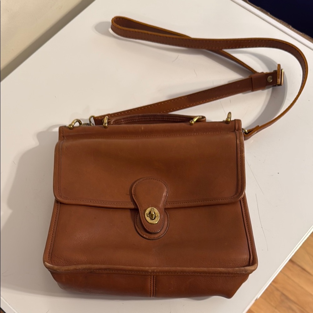 Coach Brown Crossbody Bag with Adjustable Strap and Timeless Design
